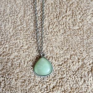 Green stone pendant with silver chain